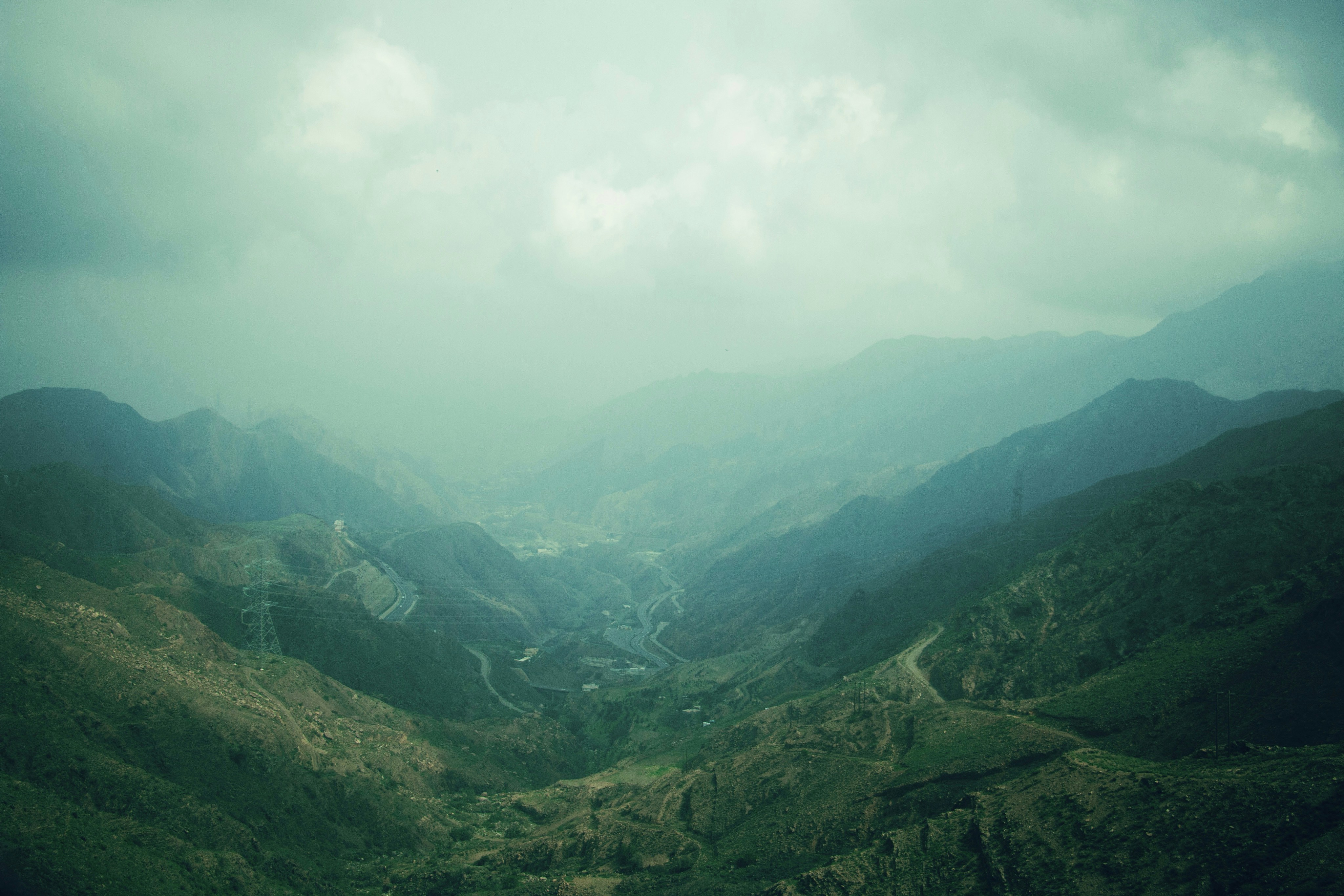 Green mountain valley in the Asir highlands near Abha, Saudi Arabia under overcast skies