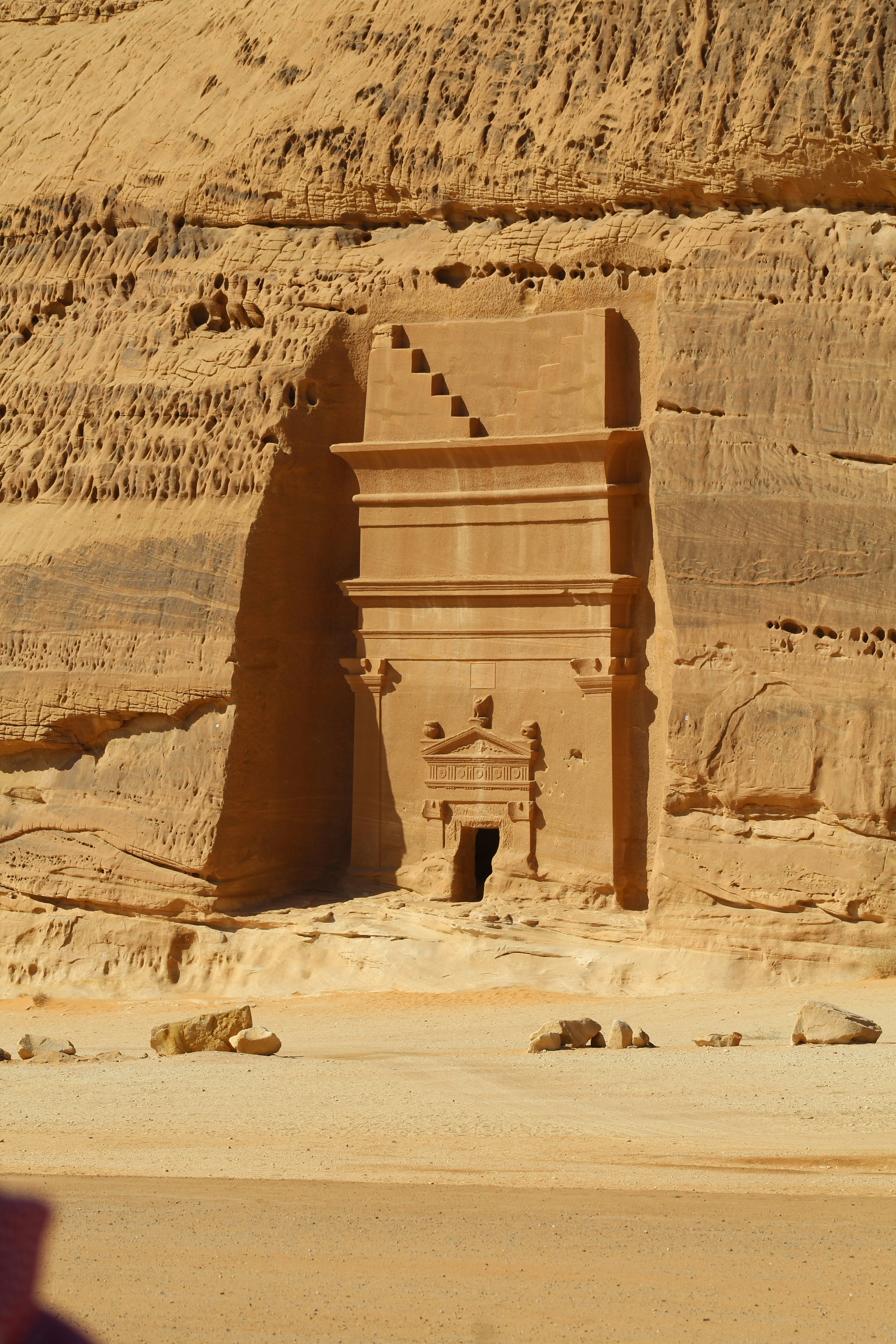 Large contemporary sculpture installation in AlUla's red sandstone desert landscape