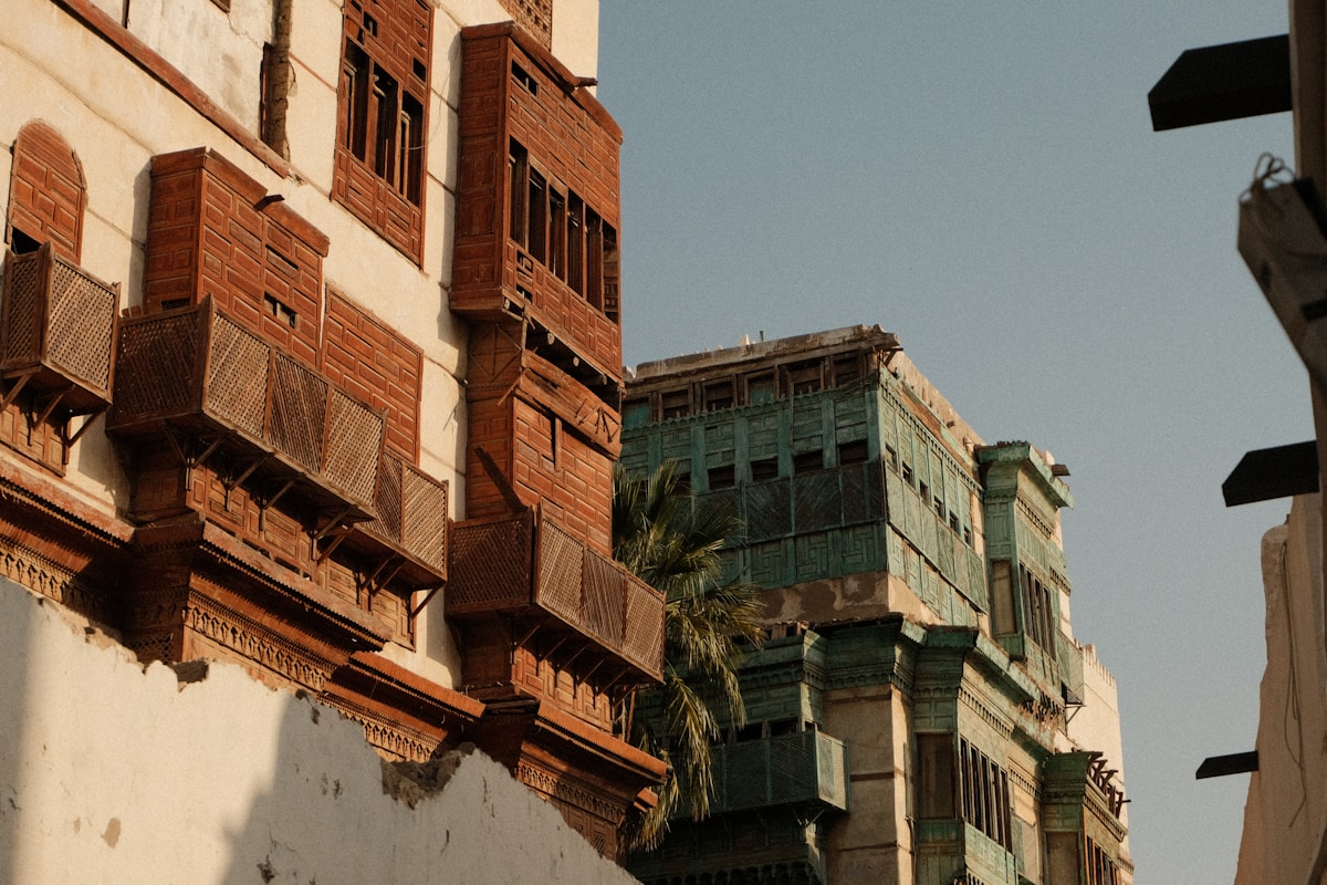 Old building with a palm tree in Al-Balad historic district, Jeddah, Saudi Arabia