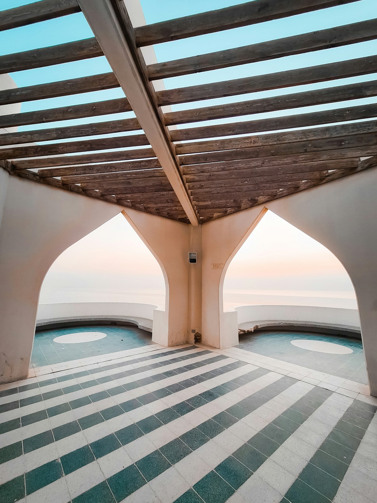 Arabic archway pavilion overlooking the Arabian Gulf at sunset, Al Khobar Corniche, Saudi Arabia
