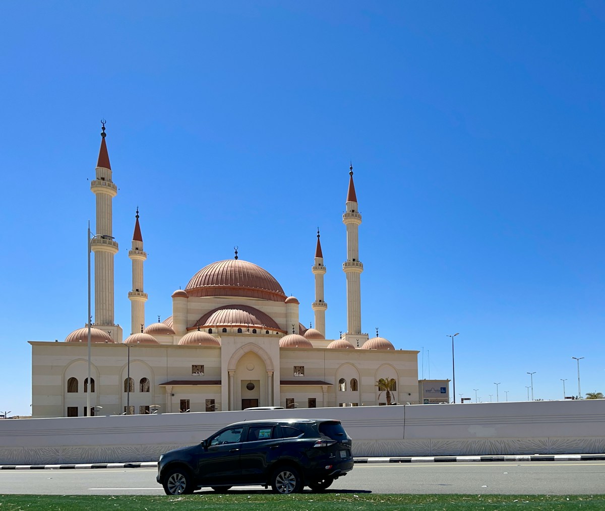 Grand mosque with distinctive copper-red domed minarets in Hail, northern Saudi Arabia