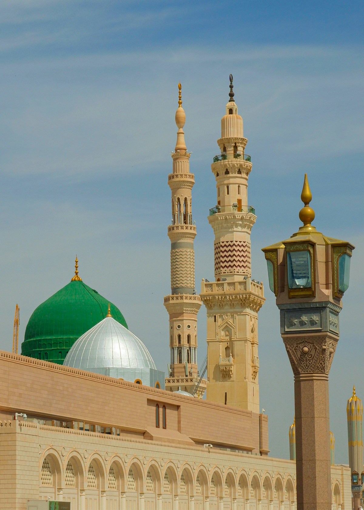 Hotels and minarets surrounding Al-Masjid an-Nabawi in Medina, Saudi Arabia