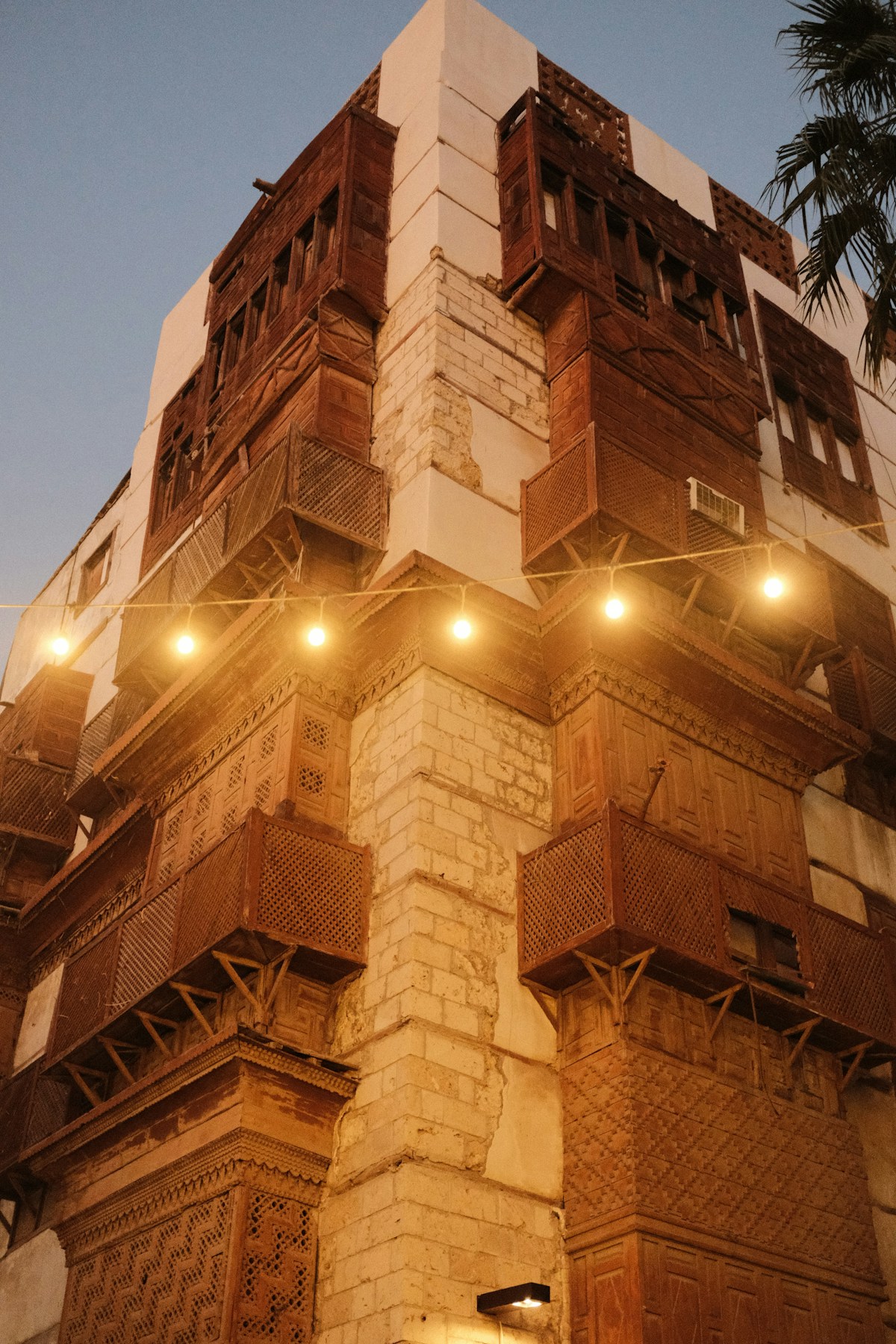 Traditional mud-brick architecture and modern hotel in Najran, southwestern Saudi Arabia