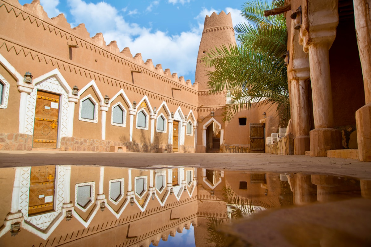 Traditional Najdi mud-brick courtyard with decorative doorways - heritage architecture in Saudi Arabia