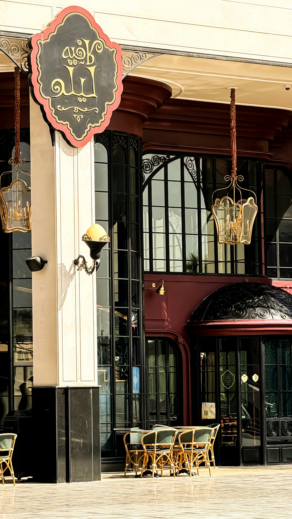Stylish restaurant exterior with ornate lanterns and Arabic signage in Riyadh