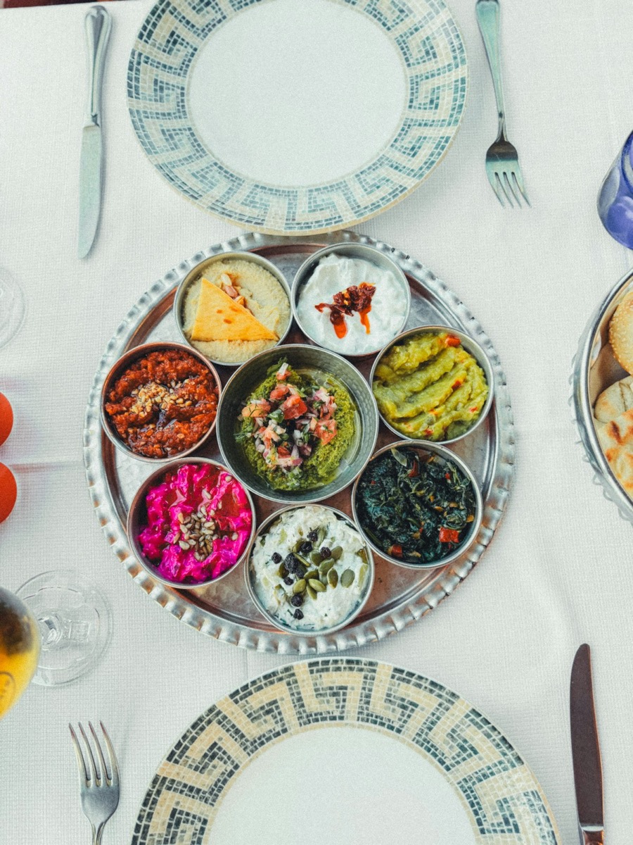 Colourful mezze spread with dips and condiments at a Riyadh restaurant - traditional Saudi starters