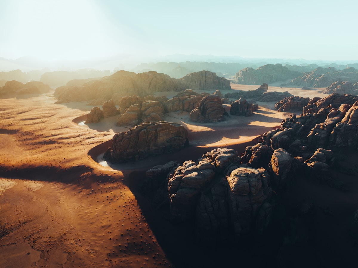 The ancient Nabataean tombs at Hegra, AlUla, carved into rose-coloured sandstone cliffs