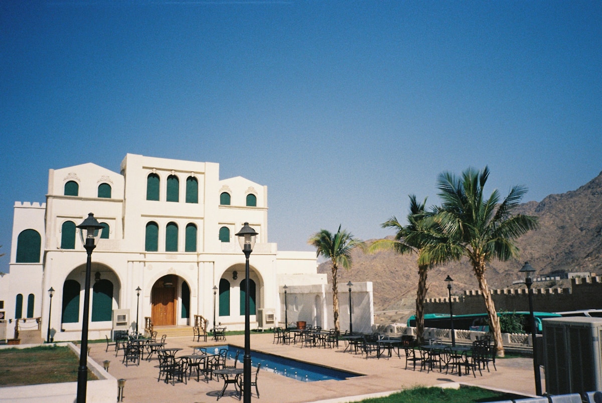 Hotel exterior with palm trees in Tabuk city, Saudi Arabia